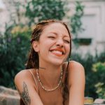 Smiling Woman Enjoying Sunny Day Outdoors